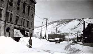 John A in front of 'John A Beck Grocery' in 1936